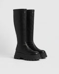 Bottes hautes à plateforme crantée Sigolène — Noir, paire vue de trois quarts en studio