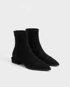 Bottines chaussette plates à bout pointu Célinie — Noir, paire en packshot studio