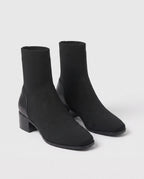 Bottines chaussettes en maille a talon bloc Cyprienne Noir — packshot studio