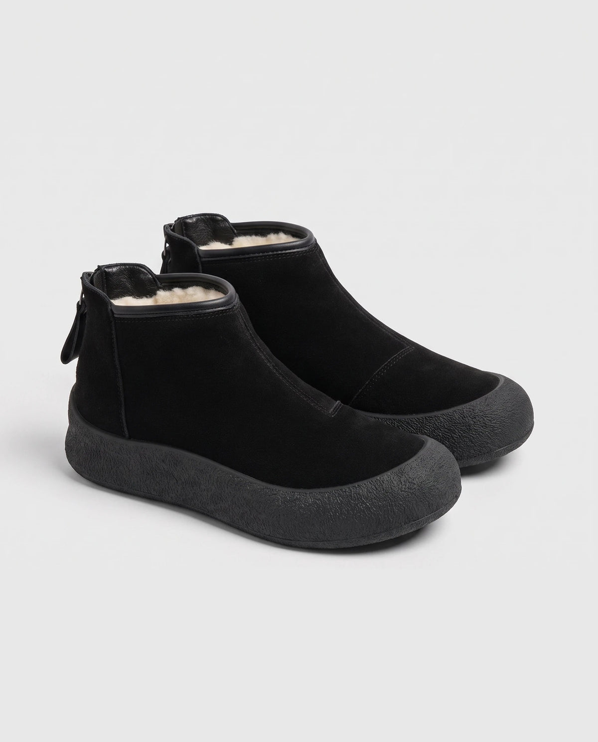Bottines de neige plates à zip dos Clarine — Noir, paire en packshot studio