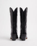 Bottes santiags mi-mollet effet cuir Maurine — Noir, paire vue de dos, coutures arrière et talons obliques