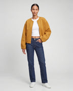 Veste zippée sans col en maille jaune moutarde Capucine, vue de face en studio